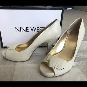 Beige Nine West peep toe pumps